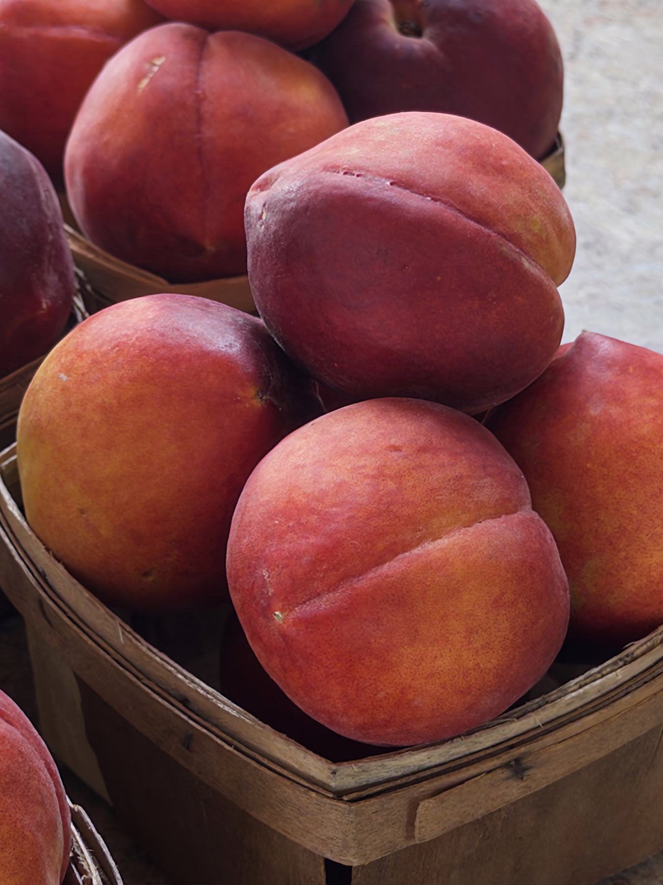 Fresh peaches at a local farmers market table